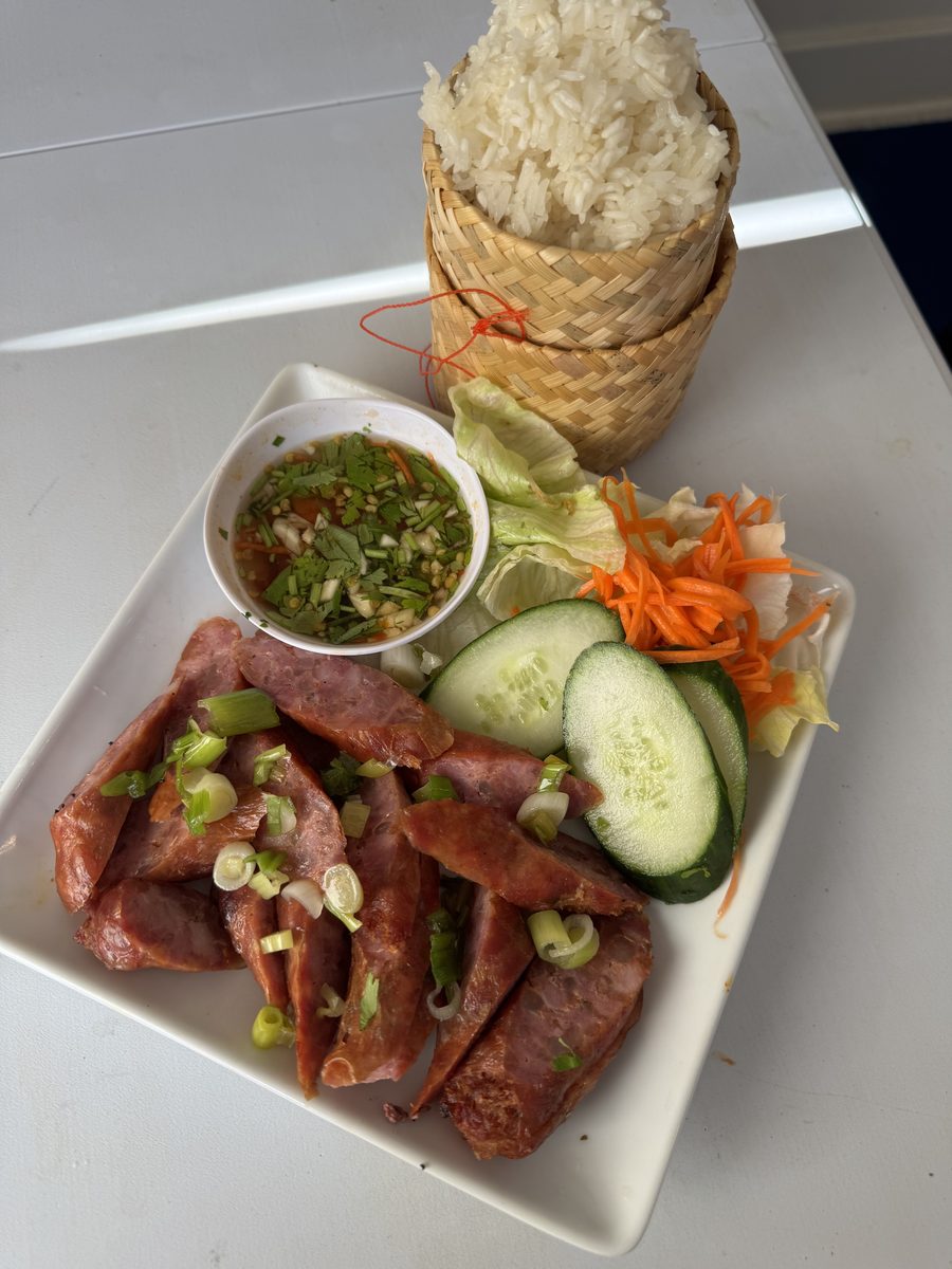 Thai sticky rice dish with lemongrass pork sausage and garlic-cilantro-lime dip